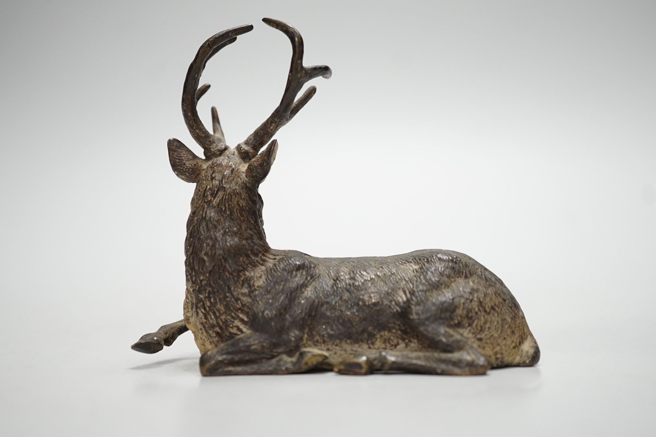 A Viennese cold-painted bronze model of a deer. 11cm wide
